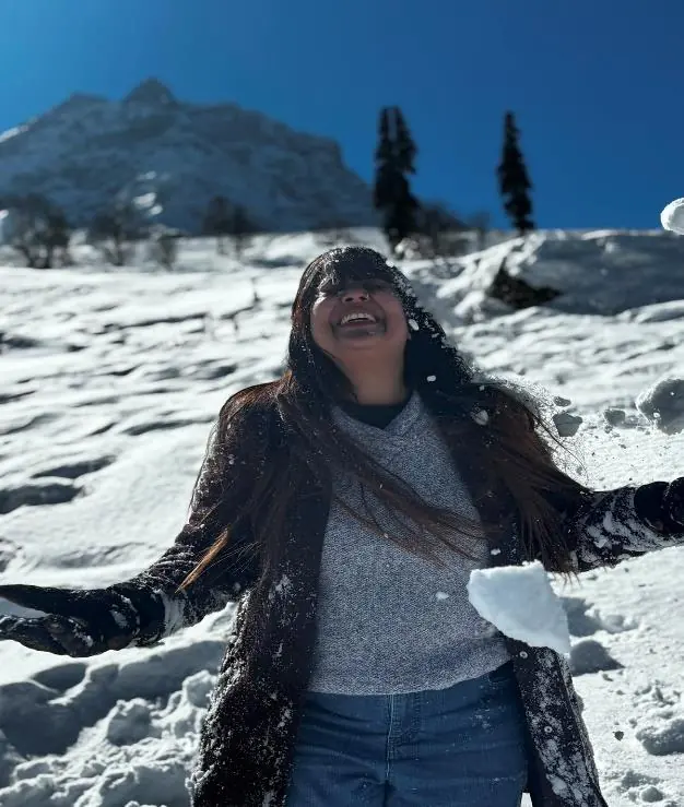 Traveller enjoying fresh snow in Kashmir